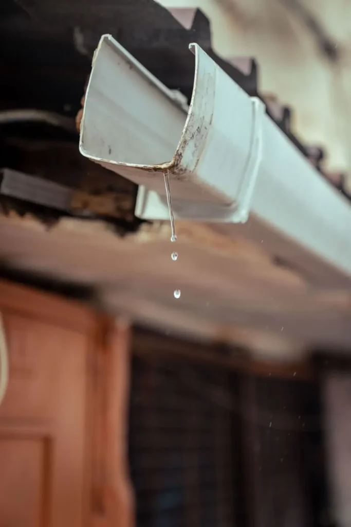 Water running freely from a clear downspout